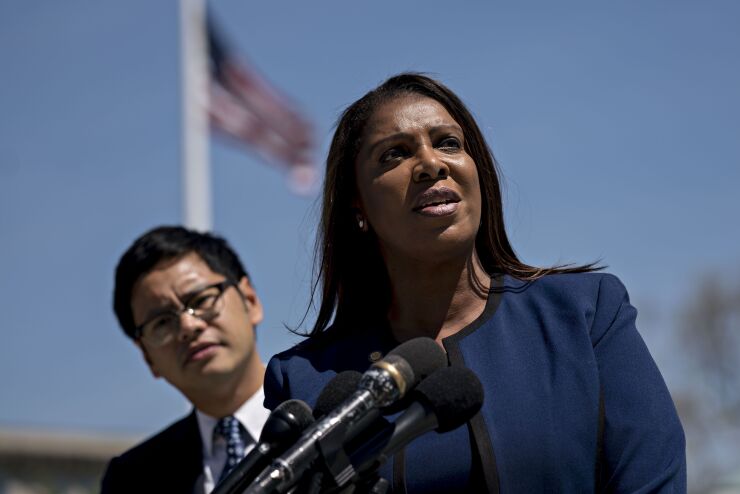 Letitia James, New York attorney general, right, speaks to members of the media as Dale Ho, director of the American Civil Liberties Union (ACLU) voting rights project, listens outside the U.S. Supreme Court after oral arguments in the Department of Commerce v. New York, 18-966, case in Washington, D.C., U.S., on Tuesday, April 23, 2019. Key Supreme Court justices seemed inclined to let the Trump administration add a question about citizenship to the 2020 census in a clash that will shape the allocation of congressional seats and federal dollars. Photographer: Andrew Harrer/Bloomberg