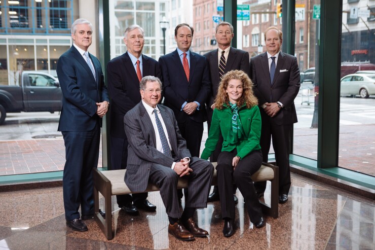 William Blair’s newest hires opened a new branch in Baltimore for the boutique wealth manager. Standing from left to right:: Hunter Purcell; Philip Rauch; Mitchell Whiteman; Robert Hopkins; Perry Bacon. Seated: Robert Oster; Darcy Carroll
