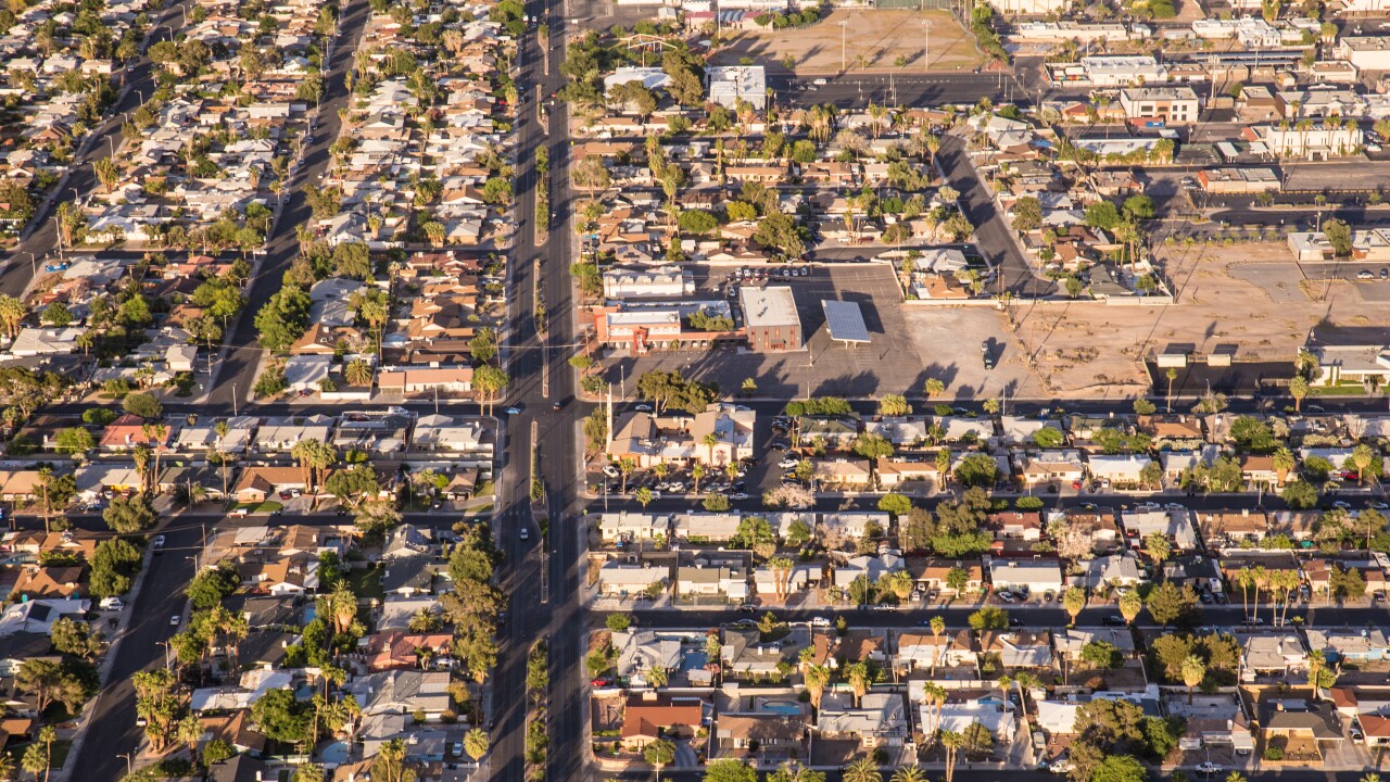 Aerial view across urban suburban communities seen from Las Vegas Nevada with streets, rooftops, and homes