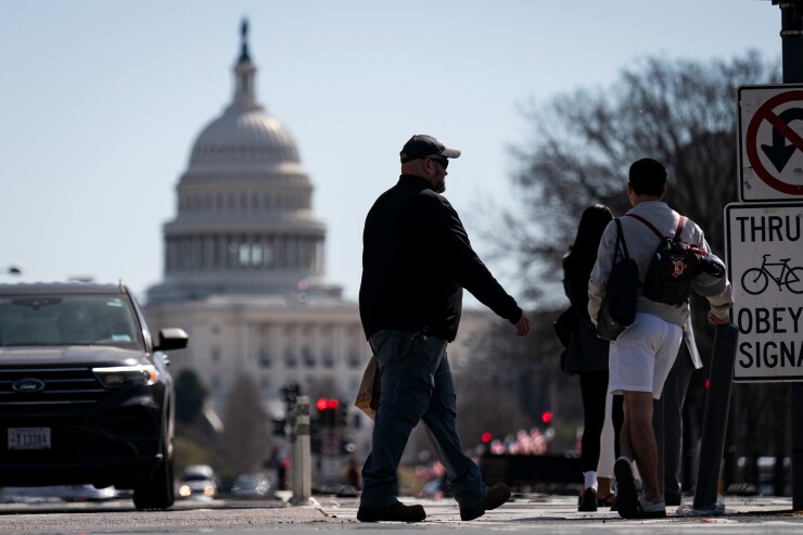 Pedestrians on Pennsylvania Avenue near the U.S. Capitol in Washington, D.C.