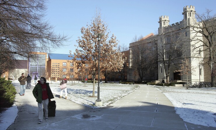 Students walk on the University of Chicago campus in Chicago, Illinois, U.S., on Friday, Dec. 11, 2009.