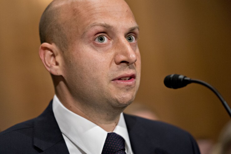 Elad Roisman, commissioner of the U.S. Securities and Exchange Commission (SEC) nominee for U.S. President Donald Trump, speaks during a Senate Banking Committee confirmation hearing in Washington, D.C., U.S., on Tuesday, July 24, 2018. Roisman, the banking committee's chief counsel, will fill the seat of Michael Piwowar who stepped down as a commissioner earlier in July.