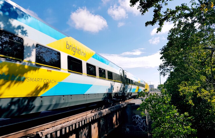 Brightline Florida, the country's only privately operated intracity passenger line, travels across a bridge.