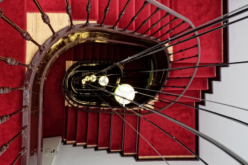 A spiral staircase, as viewed from above.