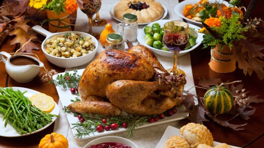 A turkey and side dishes on a table for Thanksgiving dinner