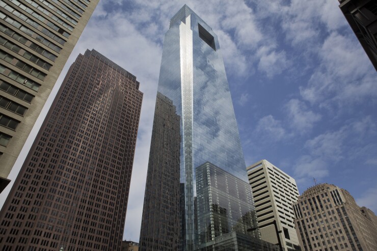 The Comcast Center, center, building stands in Philadelphia, Pennsylvania, U.S., on Saturday, May 9, 2015.