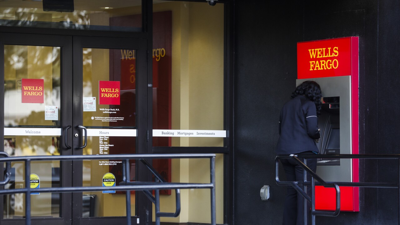 A customer uses an ATM at a Wells Fargo branch in St. Petersburg, Florida.