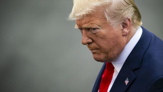 Donald Trump listens to a question while speaking to members of the media before boarding Marine One on the South Lawn of the White House in Washington, D.C.