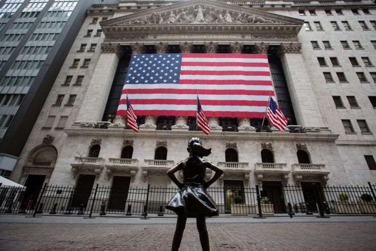 Fearless Girl statue stands across from the New York Stock Exchange March 30, 2020