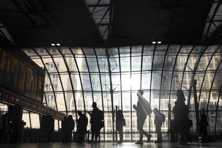 Commuters view departure boards on a railway concourse after arriving at London Waterloo railway station, in London, U.K. on Monday, March 14, 2022. U.K. unemployment dropped below its pre-pandemic level for the first time as companies generated more jobs and granted higher wages than expected. Photographer: Jason Alden/Bloomberg