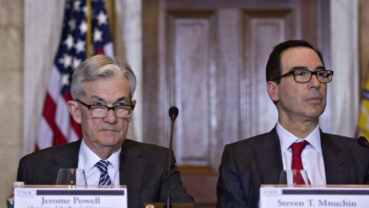Federal Reserve chairman Jerome Powell, left, and Treasury secretary Steven Mnuchin listen during a Financial Stability Oversight Council (FSOC) meeting at the Treasury Department in Washington on March 6, 2019.