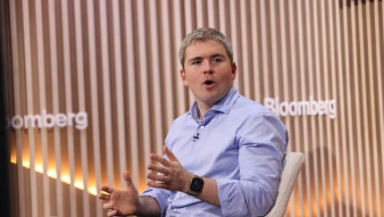 Stripe Co-founder and President John Collison on stage at Davos.
