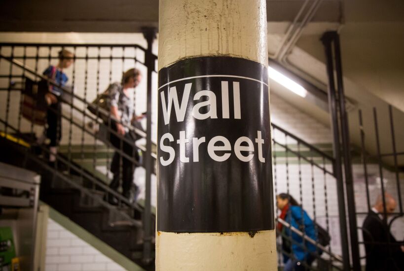 The Wall Street subway sign is seen in a station near the New York Stock Exchange (NYSE) in New York, U.S., on Friday, April 22, 2016. The Standard & Poor's 500 Index was little changed after retreating from a four-month high, as gains in oil lifted commodity producers to help offset weaker-than-forecast earnings from Microsoft Corp. and Google parent Alphabet Inc. Photographer: Michael Nagle/Bloomberg
