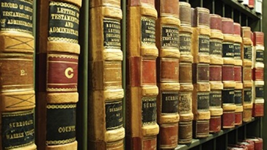 Several legal volumes lined up on a shelf.