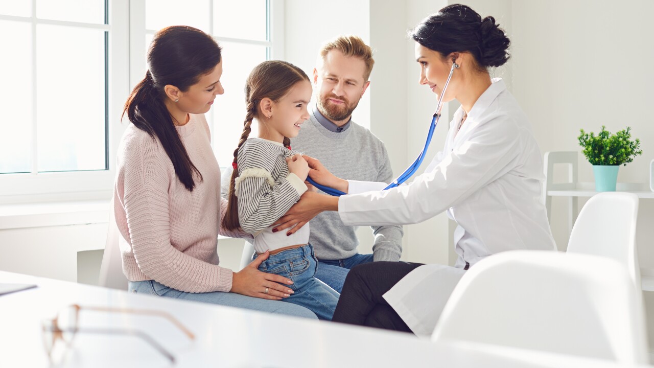 Family with small child at doctor's office