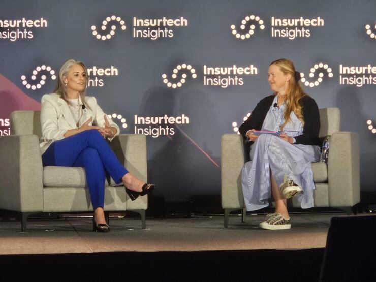Casey Kempton seated across from Lisa Wardlaw on stage at Insurtech Insights.