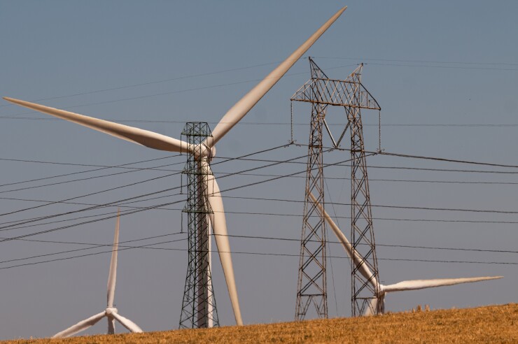 Power transmission lines and wind turbines in Rio Vista, California.