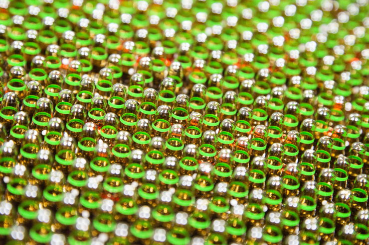 Ampoules of Neurobion vitamin supplement pass along a conveyor inside Merck KGaA's pharmaceutical laboratories at the company's headquarters in Darmstadt, Germany