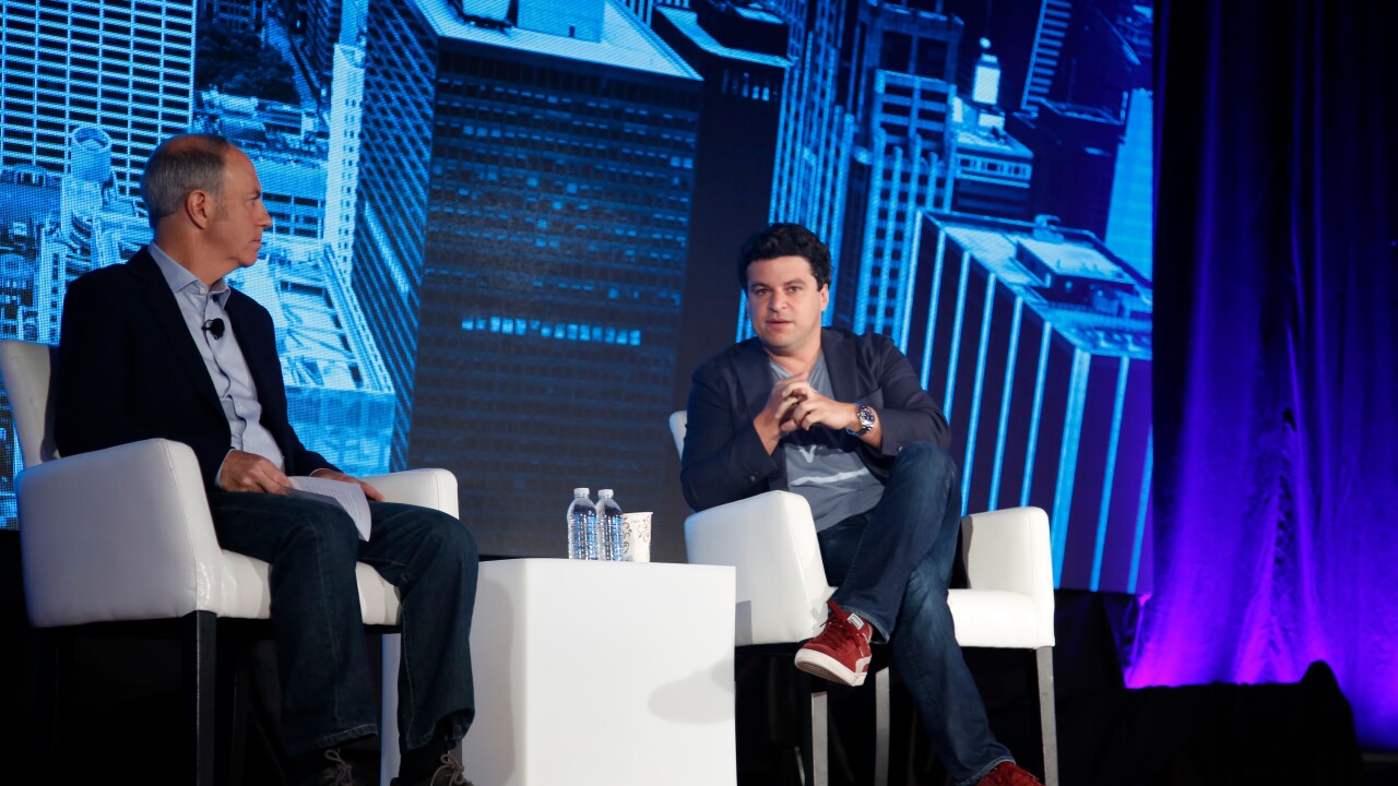 Noah Kerner, CEO of Acorns (right), speaking during a session at In|Vest 2018 in New York.