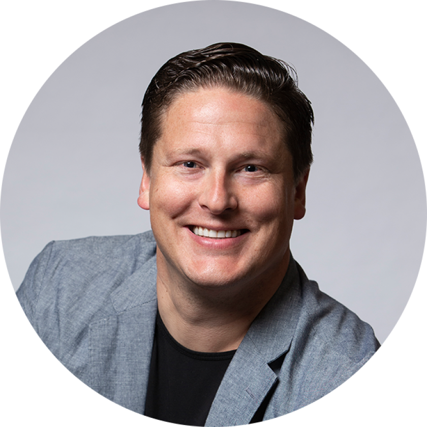 a headshot of Dustin Yoder