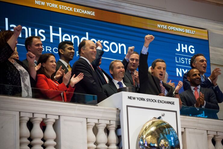 Richard Weil, co-chief executive officer of Janus Henderson Group PLC, center left, and Andrew Formica, co-chief executive officer of Janus Henderson Group PLC, center, ring the opening bell on the floor of the New York Stock Exchange (NYSE) in New York, U.S., on Friday, June 2, 2017. U.S. stocks were little changed following monthly payrolls data that fell short of expectations. Photographer: Michael Nagle/Bloomberg