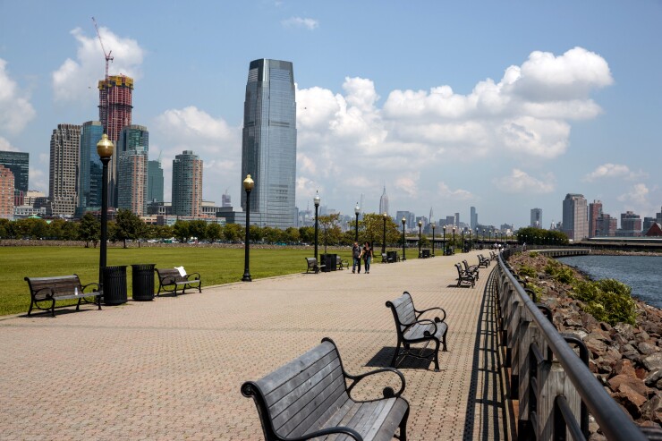 Visitors walk through Liberty State Park in Jersey City, New Jersey, U.S., on Tuesday, Aug. 14, 2018.