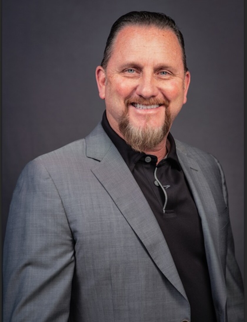 Headshot of Byron Storms.