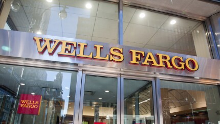Signage is displayed at a Wells Fargo bank branch in New York.