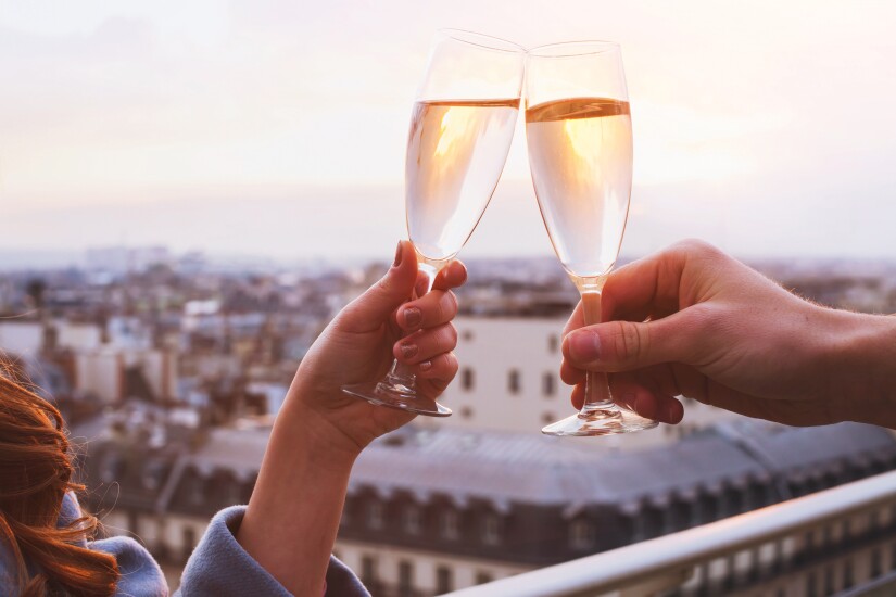 Two glasses of champagne or wine, couple dating, romantic celebration, courtship, sales