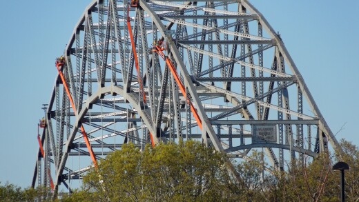 Four crews of steel workers on lifts above the Cape Cod Canal's Sagamore Bridge on the morning of Saturday, May 12, 2012.