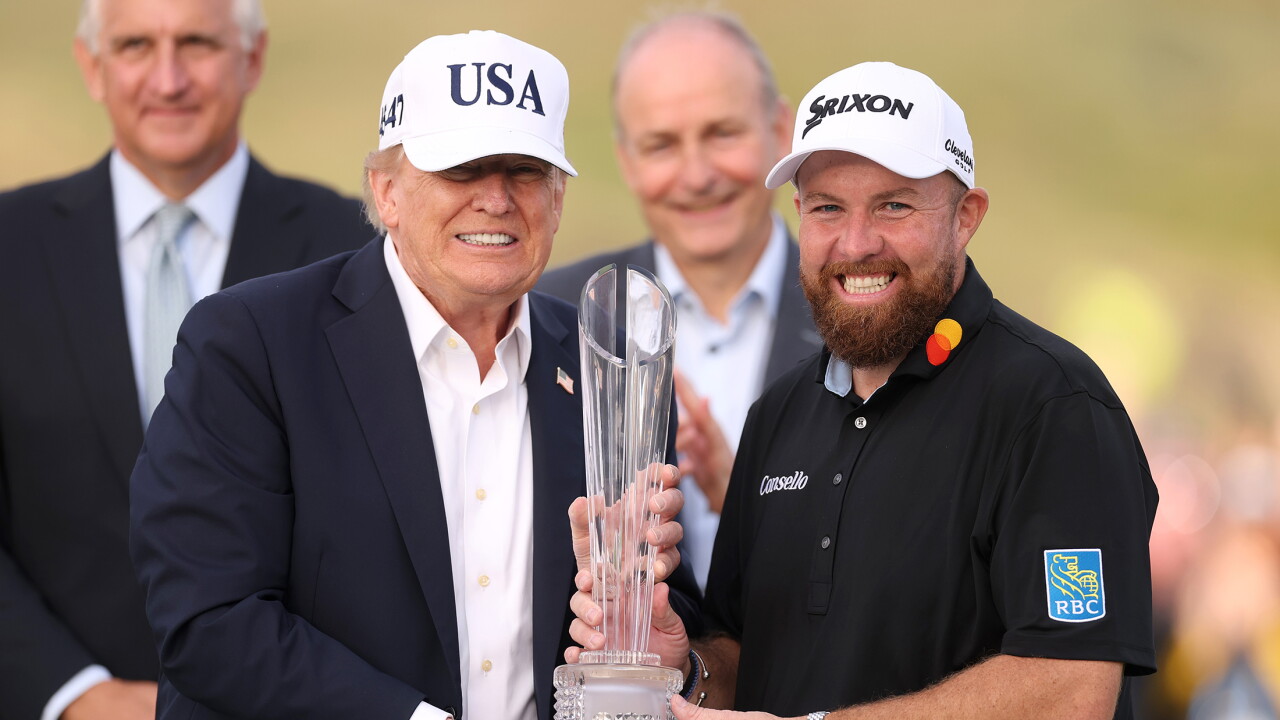 President Donald Trump, left, and Shane Lowry of Ireland pose with the trophy at the Irish Open in Doonbeg.