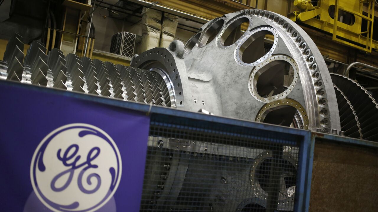 General Electric steam turbine logo pension defined benefits plan Bloomberg News