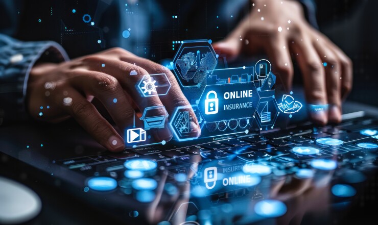 Holographic display of online insurance services above a laptop