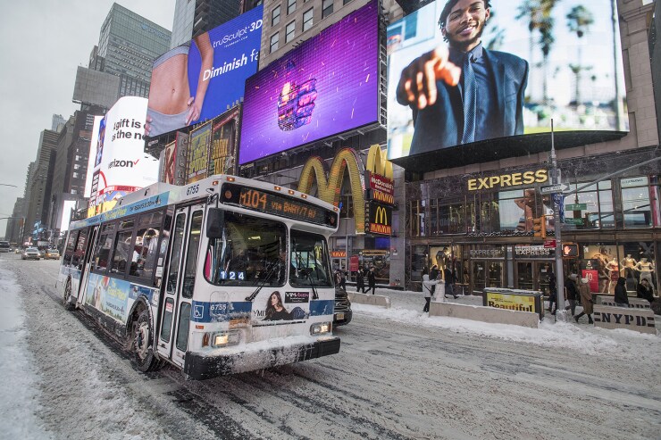 A New York City Transit bus operates in snowy Manhattan conditions on Thursday, January 4, 2018.