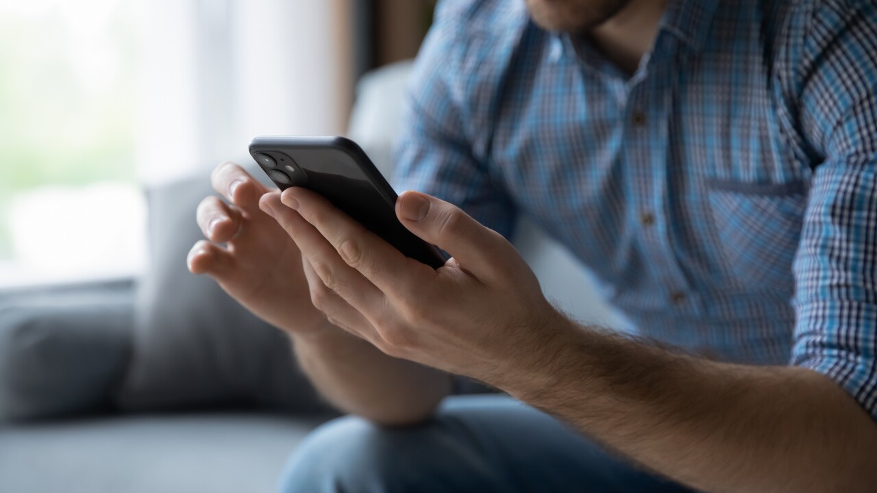 Man looking at cell phone