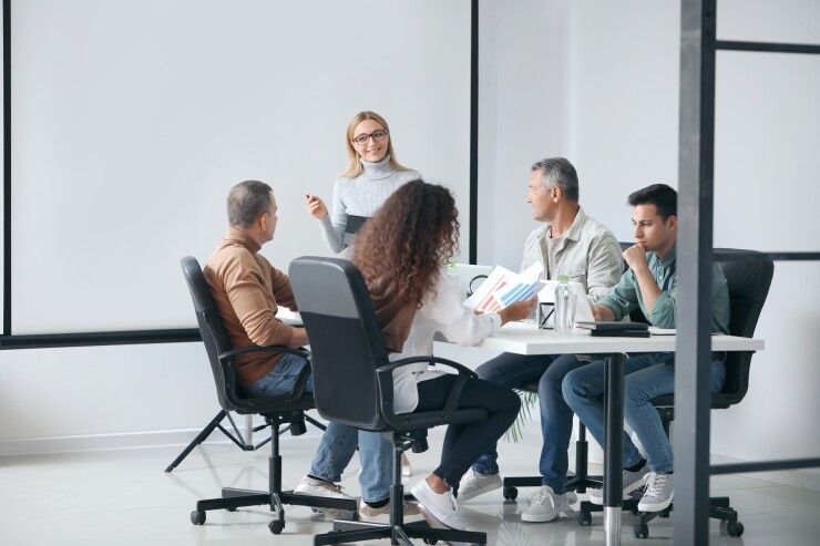 Employees at conference table