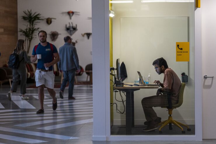 Workers inside Google's new Bay View campus in Mountain View, California, US, on Monday, May 16, 2022. On Monday Google opened its newest campus near the San Francisco Bay shoreline a few miles east of its headquarters in Mountain View. Photographer: David Paul Morris/Bloomberg