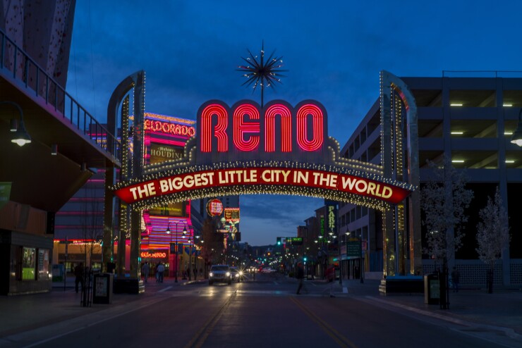 The city's slogan is displayed in neon lights over Virginia Street in Reno, Nevada, U.S., on Thursday, March 19, 2015