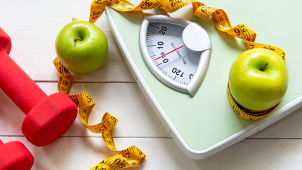 Scale, weights, apples and tape measure, healthy eating, weight loss tools