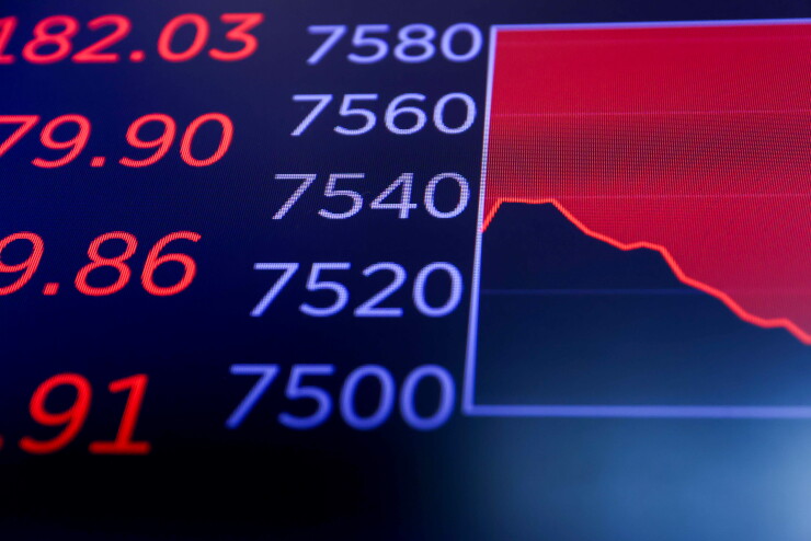 A monitor displaying the S&P 500 at the New York Stock Exchange displays how the index's value tumbled last week after a monthly federal jobs report showed elevated hiring numbers that led investors to anticipate a future interest-rate hike at the Fed that could slow down economic growth.