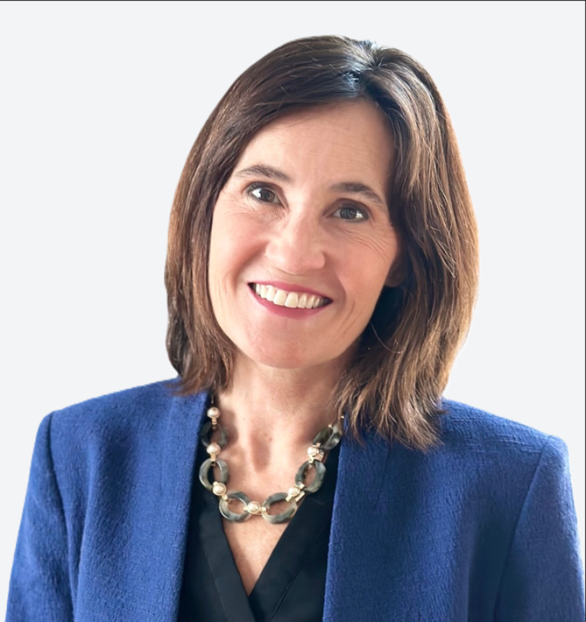 A woman smiling for a photo.
