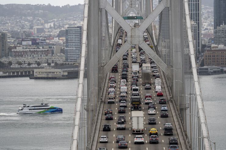Cars travel westbound across the Oakland - San Francisco Bay Bridge in San Francisco, California, U.S., on Friday, March 4, 2022. Remote-work policies have taken a toll on San Francisco, which is struggling with the nations weakest office occupancies, stubbornly low transit ridership and one of the country's slowest job recoveries. Photographer: David Paul Morris/Bloomberg