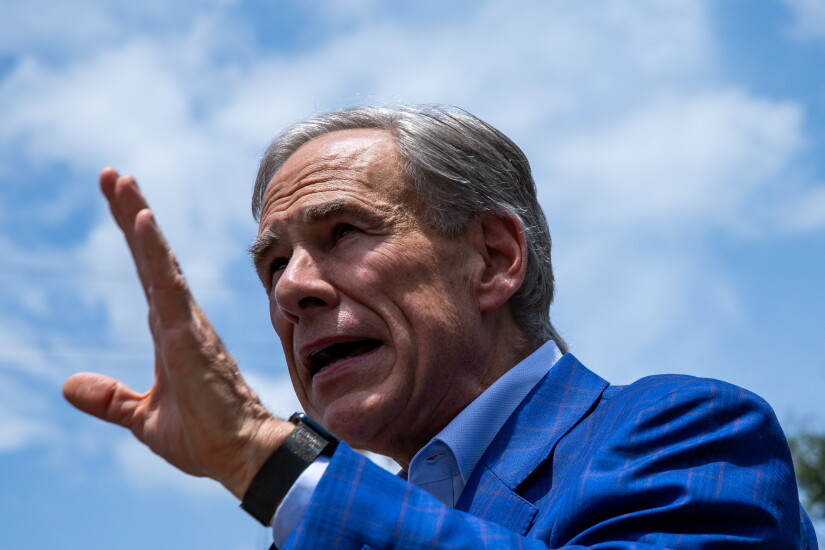 Abbott speaks to the media after casting ballot