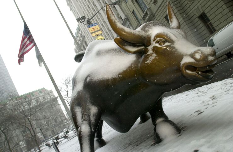 Wall Street Bull sits covered in snow today, Tuesday, March 6, 2001