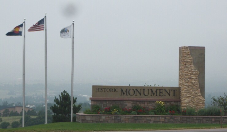 Welcome sign to Monument, Colo.