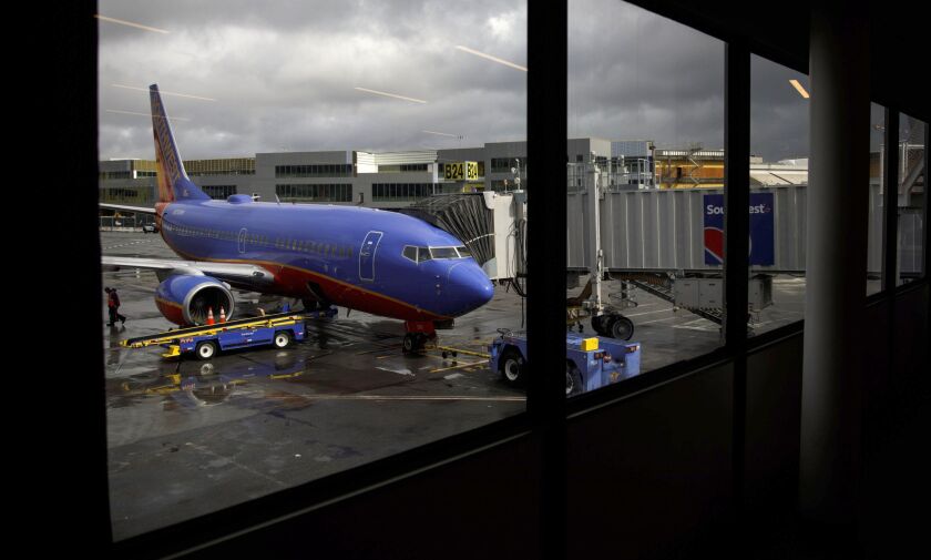 A Southwest aircraft stands on the tarmac at San Francisco International Airport.