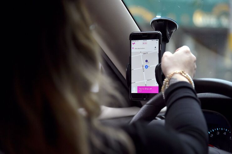 Lyft At Its San Francisco Headquarters Showcasing Lyft Cars, The Glowstache, The Lyft App, Lyft Passengers And Drivers