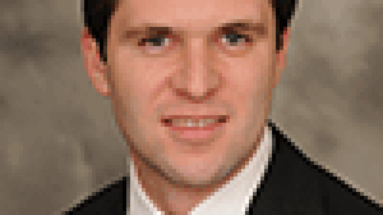 feltnertom100x133.gif