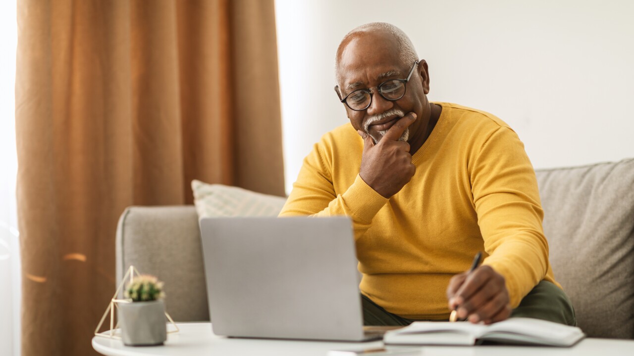 Man working on laptop from home