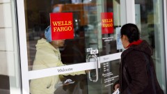 Wells Fargo customers enter and exit a branch